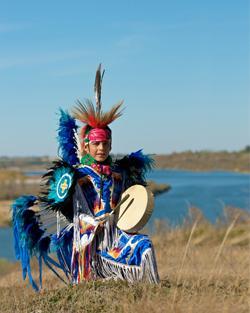 First Nation boy drumming